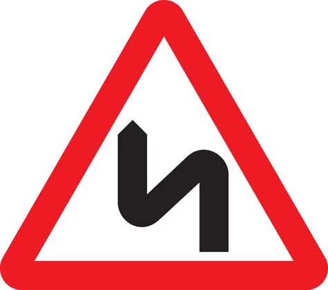 UK double bend warning sign
